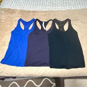 Set of 3. Size 6 Lululemon Athletica workout razorback tank tops.